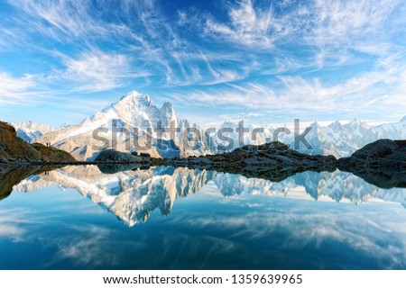 Incredible view of clear water and sky reflection on Lac Blanc lake in France Alps. Monte Bianco mountains range on background. Landscape photography, Chamonix.