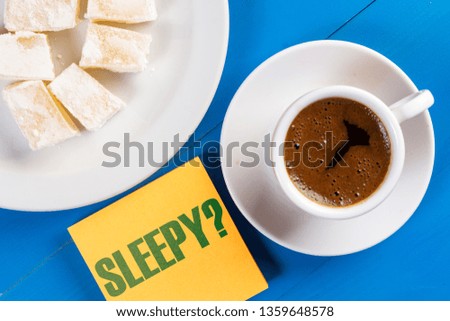 Sleepy Text Concept With Cup Of Coffee On The Table.