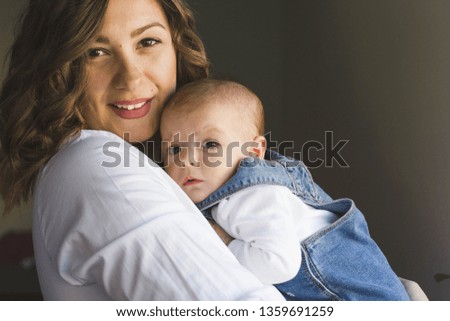 family, motherhood and people concept - happy mother with little baby girl at home - Image
