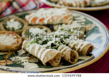 tacos dorados, flautas de pollo, chicken tacos and spicy Salsa Homemade Mexican food in mexico