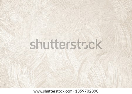 Paper wallpaper on the walls of  beige house with a scratch pattern. Abstract background, pastel cream colored vintage carpet, soft wrinkled pattern with golden faded lines on luxury bedroom in hotel.