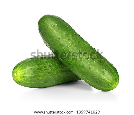 Two cucumbers on an isolated white background Royalty-Free Stock Photo #1359741629