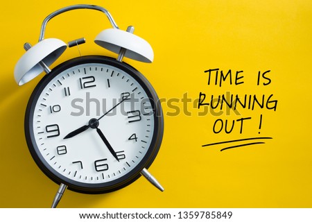 Time is Running Out Concept with alarm clock aside.