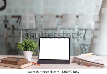 Laptop on white wooden business workspace desk.