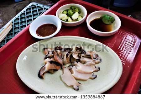 Raw abalone, sea snail on Jeju, Korea Royalty-Free Stock Photo #1359884867