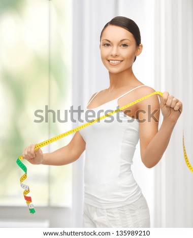 picture of sporty woman with measuring tape