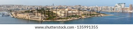 A panoramic view of Manoel Island, and the recently restored Fort carrying the same name.  On the left is the old Lazzaret Hospital and RN submarine depot; to the right the modern skyline of Sliema.