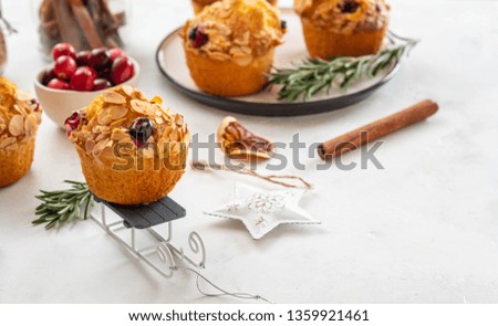 Christmas homemade cranberry muffins. Christmas cake on New Year's background. Copy space.