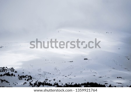 This is a capture for mountains covered with white snow located in north Lebanon, the shot was taken in late march 2019 