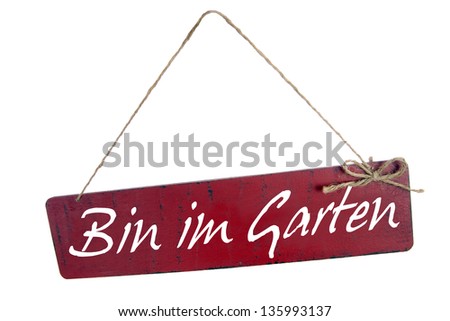 shield with the german words I'm in the garden / garden time