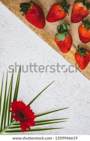 Flat lay with white background with Tropical fruits and flowers