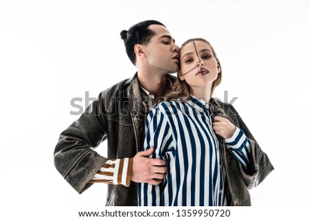 One leather jacket. Professional young models wearing striped shirt and one leather jacket