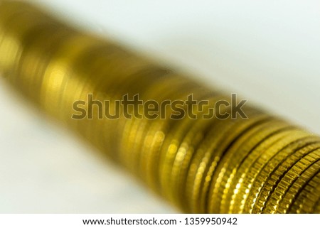 Macro photo of a long stack of coins. Stack lying on their side. A good image for a site about finance, money, collection, relationships.