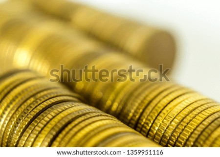 Macro photo of a long stack of coins. Stack lying on their sides. A good image for a site about finance, money, collection, relationships.