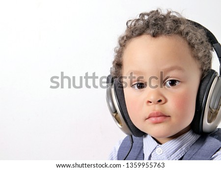 little boy with headphones enjoying disco music stock photo