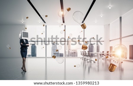 Business woman in suit with monitor instead of head keeping arms crossed while standing among flying lightbulbs inside office building. 3D rendering.