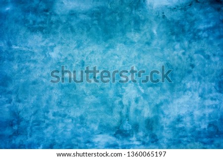 Grunge blue painted wall texture background.