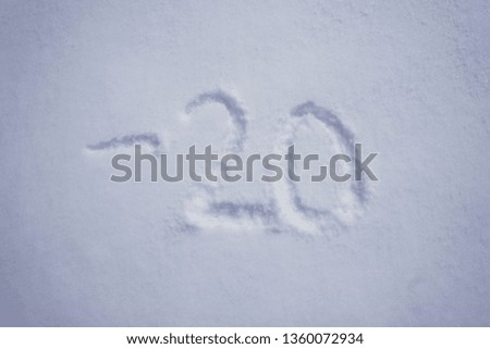 minus 20 degree celsius written into a snow background