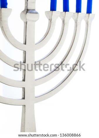 Contemporary menorah with blue candels on white background.
