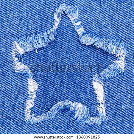 Star Denim blue patch. Denim jeans cloth fashion background. Fabric recycling concept. Christmas crafting 