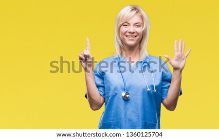 Young beautiful blonde doctor woman wearing medical uniform over isolated background showing and pointing up with fingers number six while smiling confident and happy.