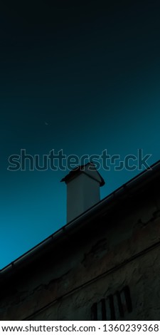 night shot of a chimney in a beautiful dark blue gradient