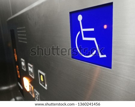 Disabled person sign in the elevator lift