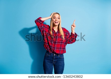 Attention. Portrait of astonished funny girl impressed news information adverts advertise decide recommend display present way touch head hand wear youngster denim outfit isolated blue background