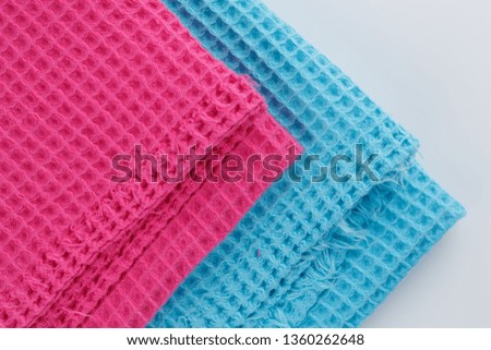 Pink and blue corrugated cotton textile - close up of fabric texture. Cotton Fabric Texture. Pink Clothing Background. Text Space. Abstract background and texture for designers.