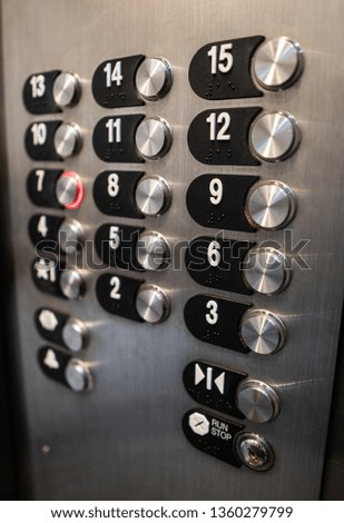 Metallic elevator buttons for 15 floors 