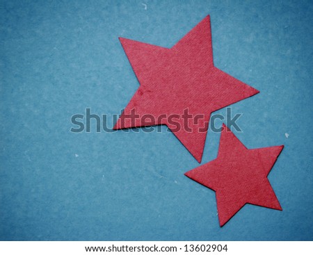 2 Red paper Stars on Blue paper background