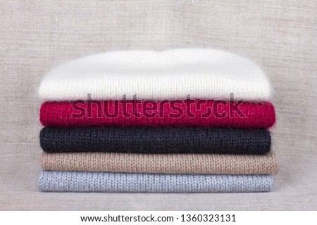 Knitted wool items stacked