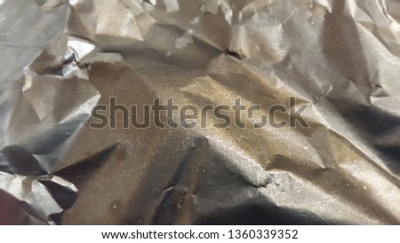 Foil. Crumpled foil. Background of crumpled foil. Creative background