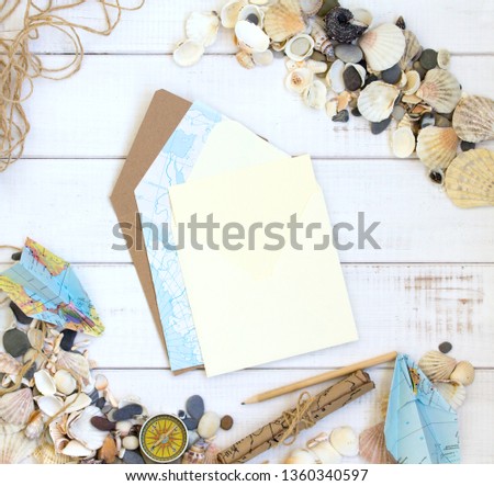 envelopes, sea shells, white wooden background mockup