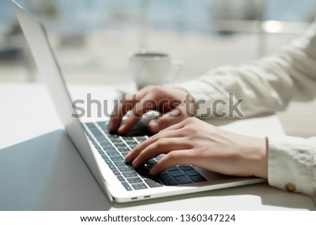 Lifestyle education student. Businessman work on laptop for project. Millennial at home office drink coffee looking for job on notebook. Unrecognizable man using modern portable computer and phone.