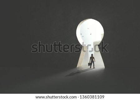 business man passing under keyhole shape door to reach the city, surreal concept