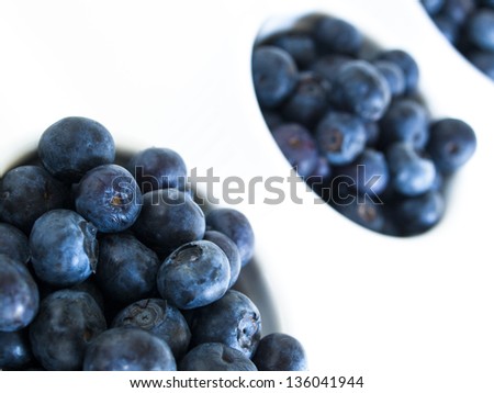 Fresh bluberries from local market on white background. Blueberries contain anthocyanins,  and various phytochemicals, which possibly have a role in reducing risks of some diseases.