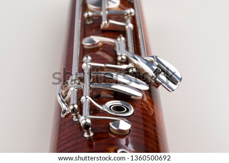 Wooden bassoon isolated on a white background. Music instruments. Royalty-Free Stock Photo #1360500692
