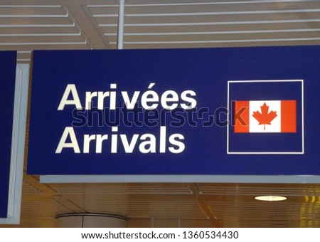 French and English bilingual sign depicting arrivals at Canadian airport
