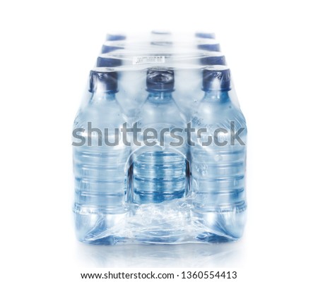 packed bottled water on white Royalty-Free Stock Photo #1360554413