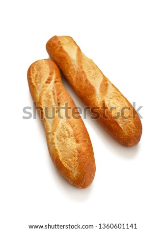 Two fresh crispy French baguettes with Golden crust isolated on white background