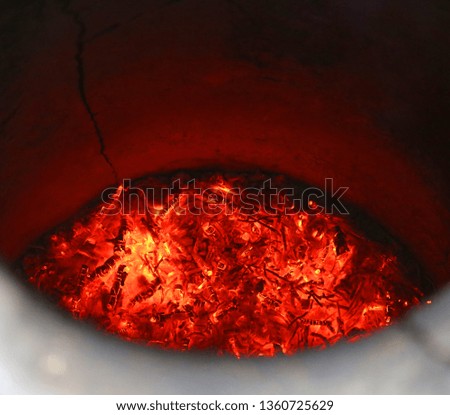 Photo background of a bright red oven with coals for making bread