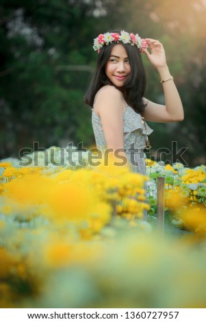 Asian woman in the flower garden
