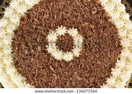 Photography of a chocolate shavings and cream from a cake.