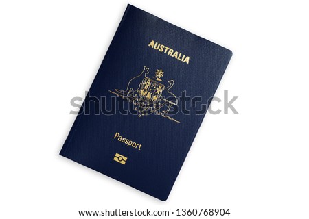 Australian blue biometric passport isolated on white background Royalty-Free Stock Photo #1360768904