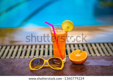 Exotic tropical summer drinks beside the swimming pool.