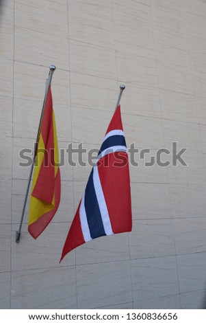 the spanish and norwegian flag in the wind, Costa Blanca, Spain