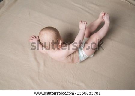Cute baby girl. A series of photos with her growing up. Studio light. Pink color palette.