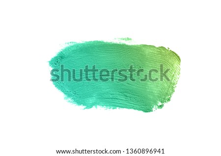 Smear and texture of lipstick or acrylic paint isolated on white background. Stroke of lipgloss or liquid nail polish swatch smudge sample. Element for beauty cosmetic design. Emerald color