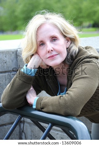 Woman taking a break from exercising in a park.